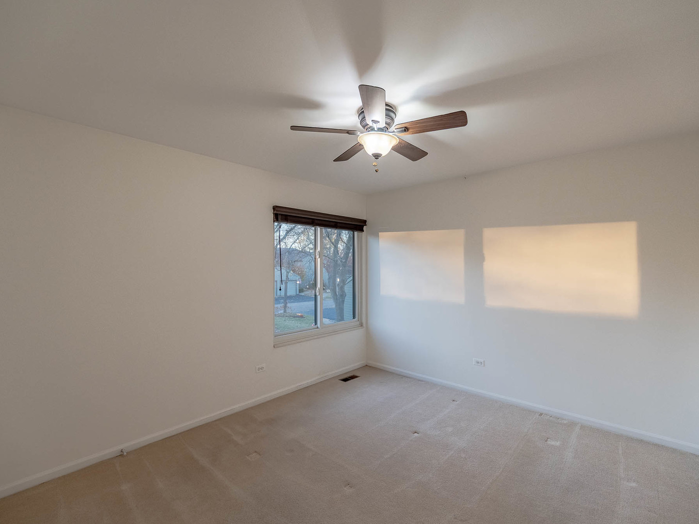 245 Timber Ridge Lane, Unit 245 Lake Barrington, IL 60010 - Photo 8 of 16 a view of an empty room with a window