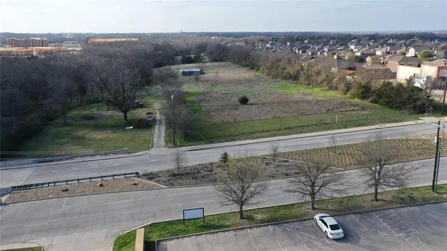 an aerial view of a yard with a bench