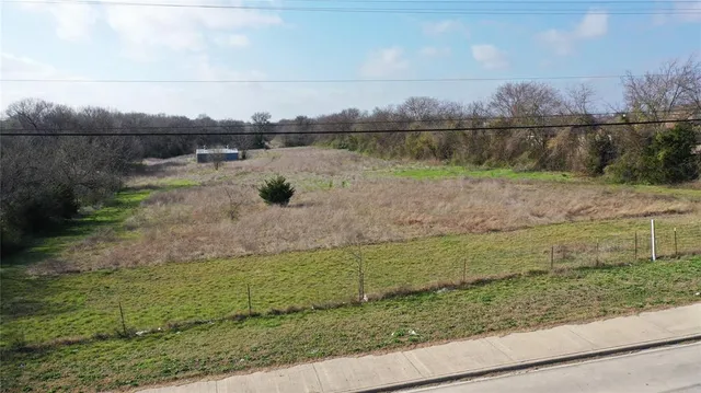a view of a lake with houses in the background