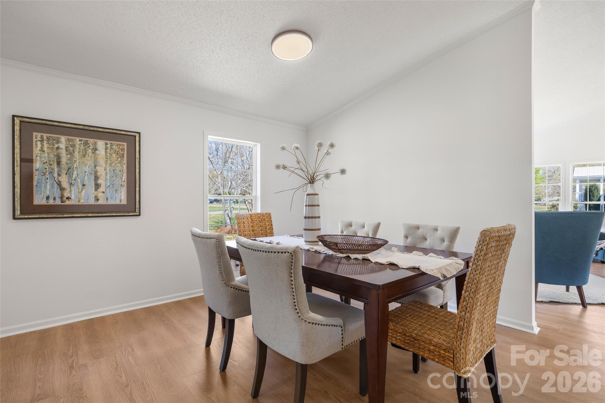 161 Baxter Way Forest City, NC 28043 - Photo 11 of 31 a view of a dining room with furniture window and wooden floor