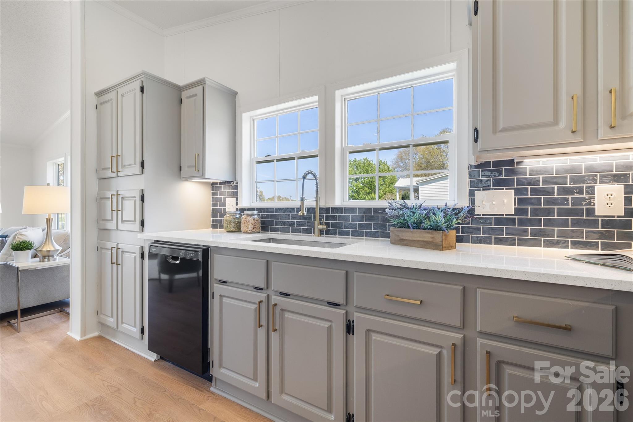161 Baxter Way Forest City, NC 28043 - Photo 14 of 31 a kitchen with cabinets appliances a sink and a window