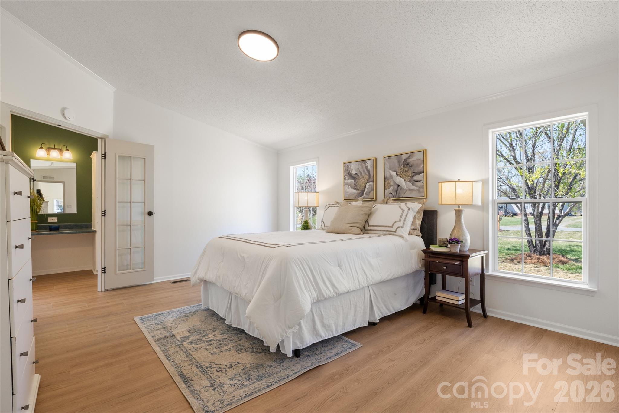 161 Baxter Way Forest City, NC 28043 - Photo 18 of 31 a bedroom with a large bed a rug and windows