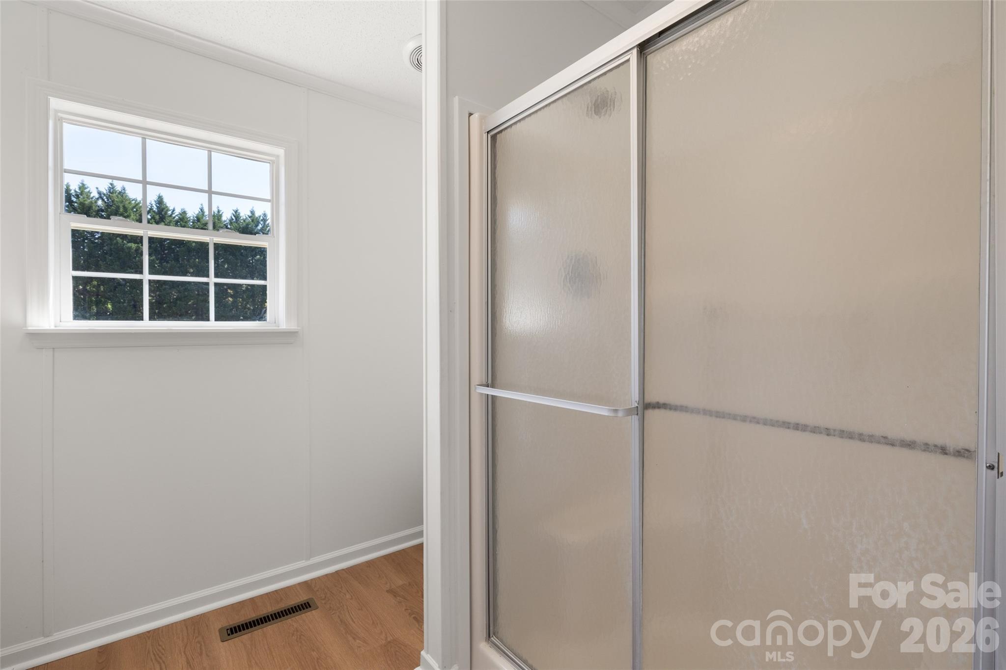 161 Baxter Way Forest City, NC 28043 - Photo 21 of 31 a bathroom with a glass shower door
