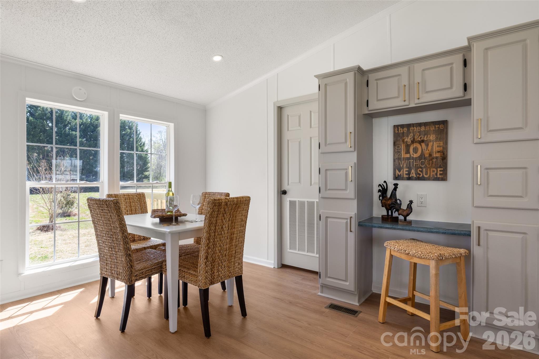 161 Baxter Way Forest City, NC 28043 - Photo 3 of 31 a dining room with furniture and wooden floor