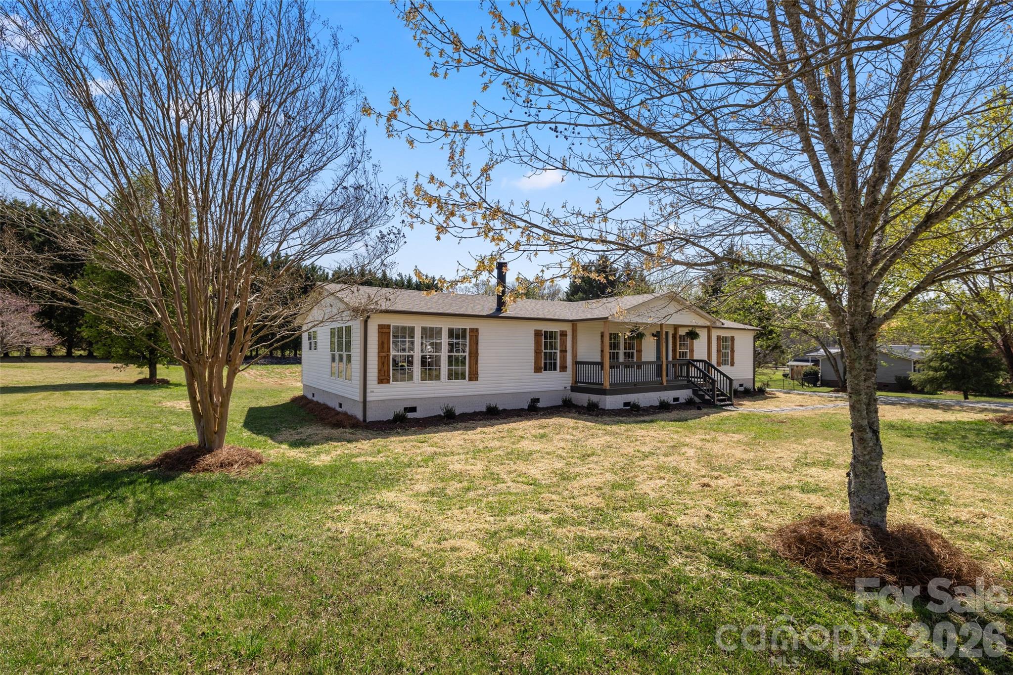 161 Baxter Way Forest City, NC 28043 - Photo 5 of 31 a view of a yard in front of a house with large tree