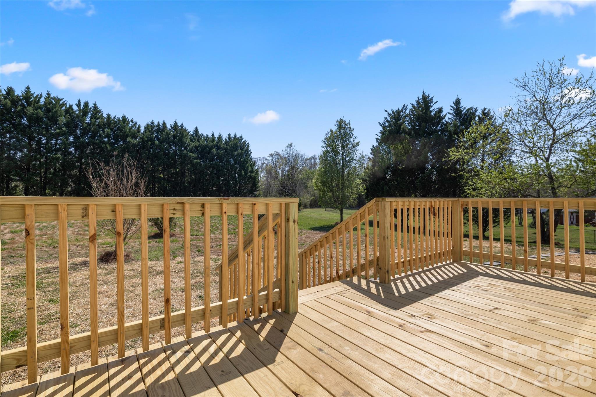 161 Baxter Way Forest City, NC 28043 - Photo 7 of 31 a view of a wooden balcony with wooden floor and fence