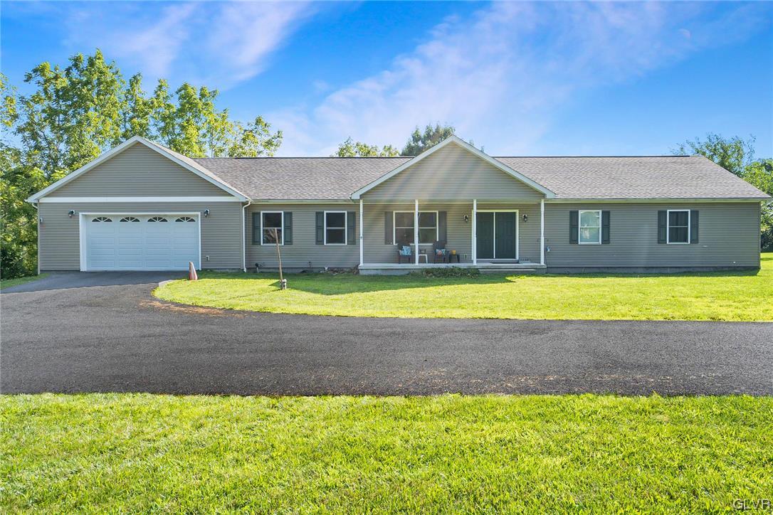 1103 Bushkill Center Road Nazareth, PA 18064 - Photo 11 of 47 a view of a house with a swimming pool and a yard