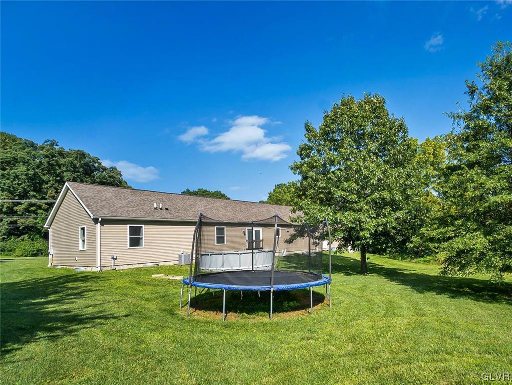 1103 Bushkill Center Road Nazareth, PA 18064 - Photo 12 of 47 a view of a house with a backyard