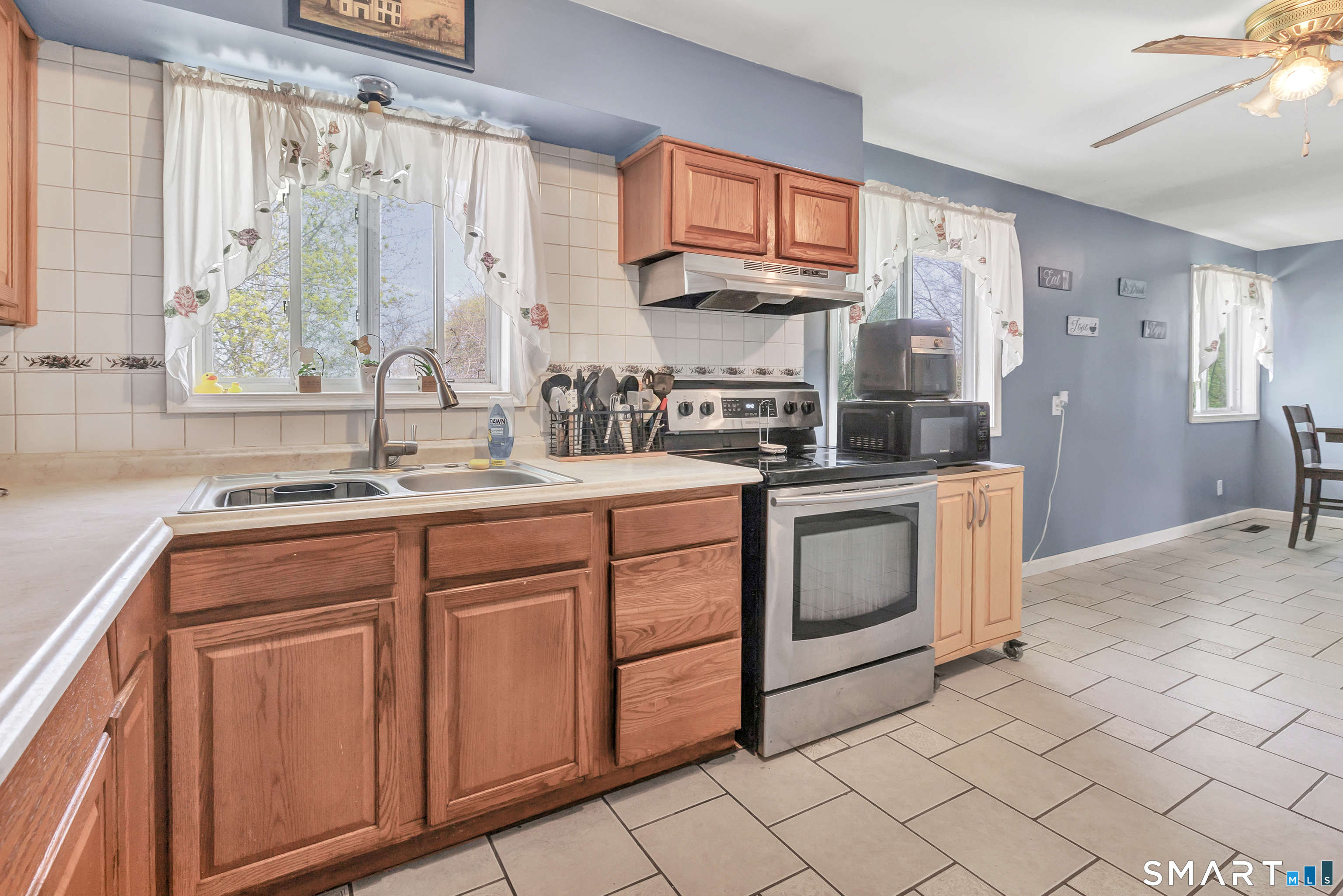 9 Alan Drive Ansonia, CT 06401 - Photo 13 of 34 a kitchen with stainless steel appliances granite countertop a sink stove and cabinets