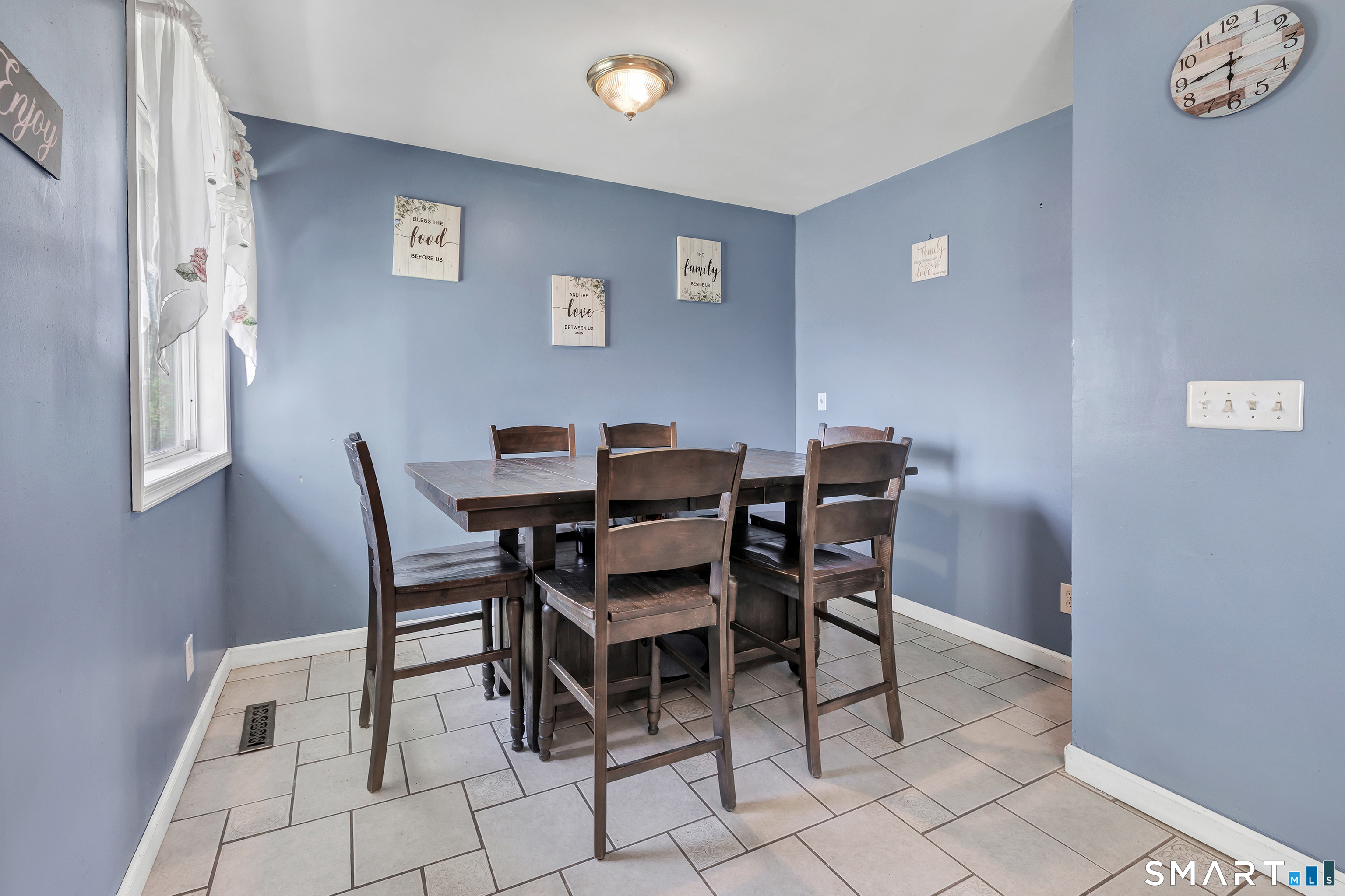 9 Alan Drive Ansonia, CT 06401 - Photo 16 of 34 a dining room with furniture and a window