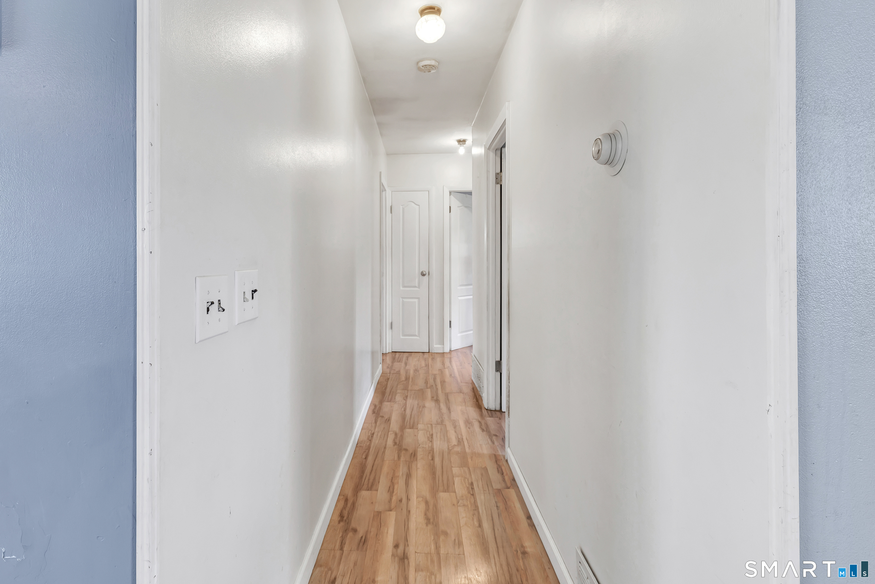 9 Alan Drive Ansonia, CT 06401 - Photo 19 of 34 a view of a hallway with wooden floor