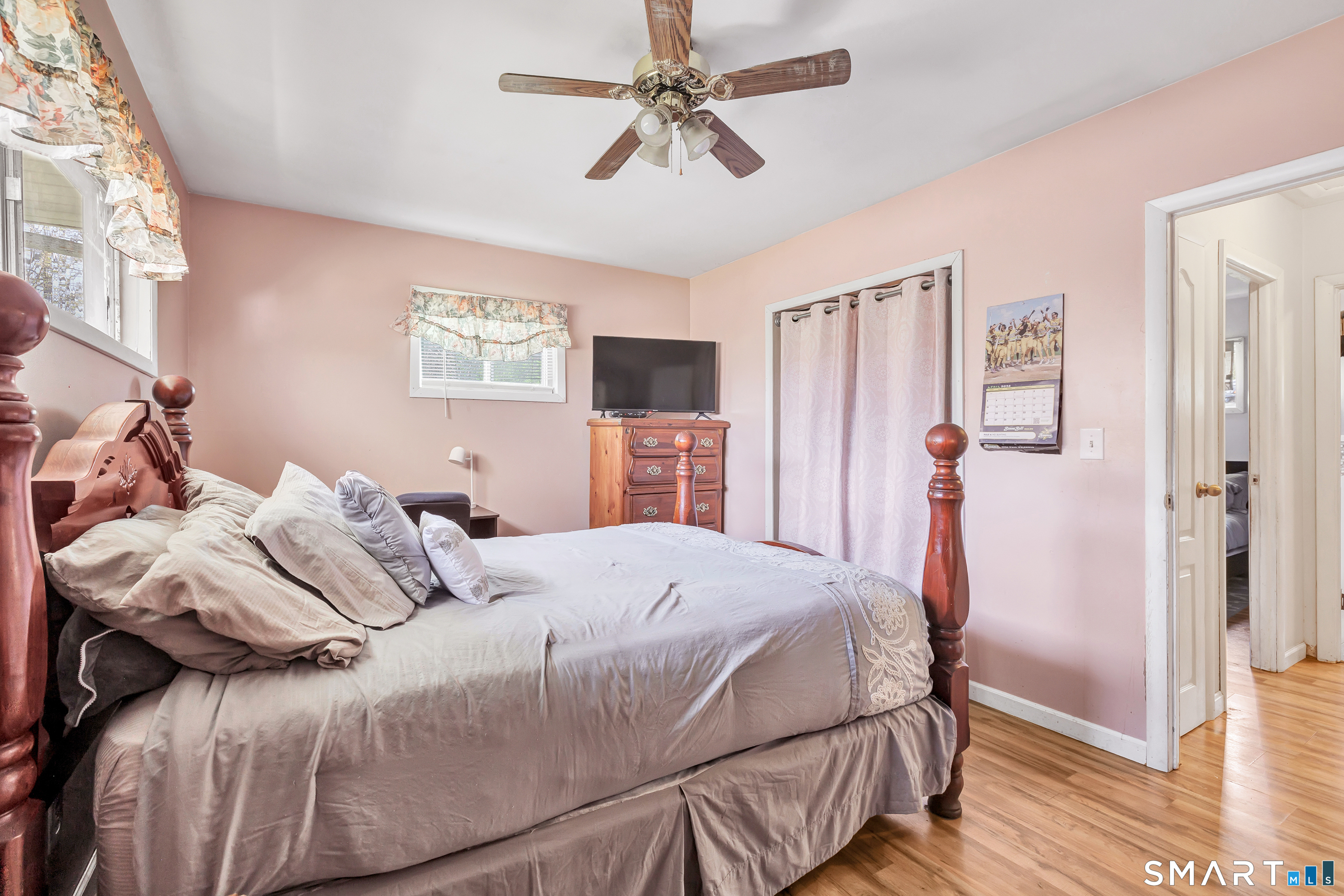9 Alan Drive Ansonia, CT 06401 - Photo 21 of 34 a bedroom with a bed and a chandelier