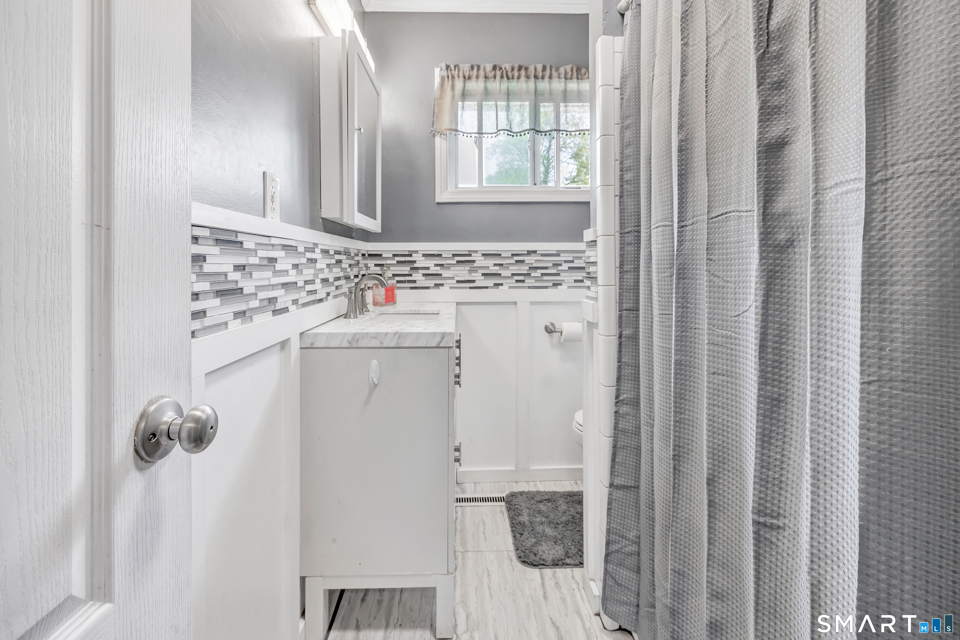 9 Alan Drive Ansonia, CT 06401 - Photo 23 of 34 a bathroom with a sink and a mirror