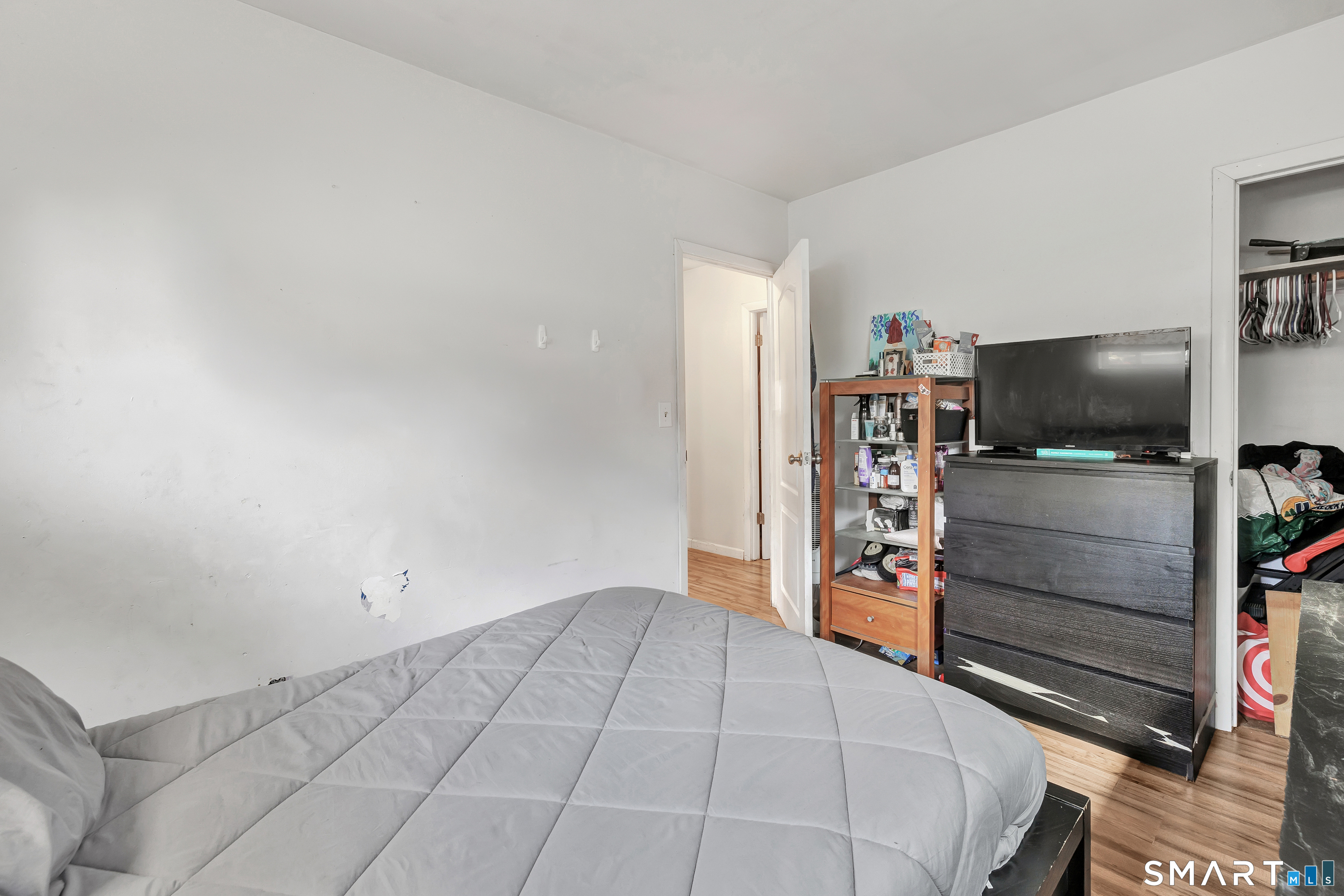 9 Alan Drive Ansonia, CT 06401 - Photo 24 of 34 a bedroom with a bed and flat screen tv