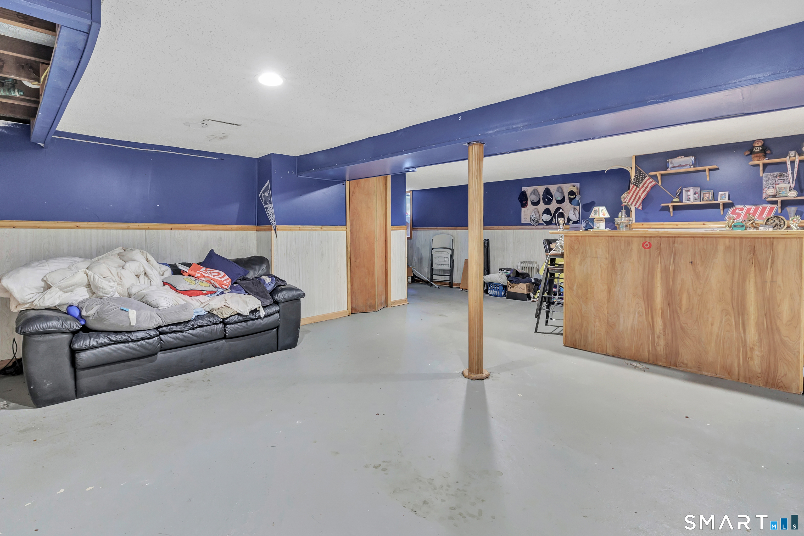 9 Alan Drive Ansonia, CT 06401 - Photo 29 of 34 a bed room with furniture and a book shelf