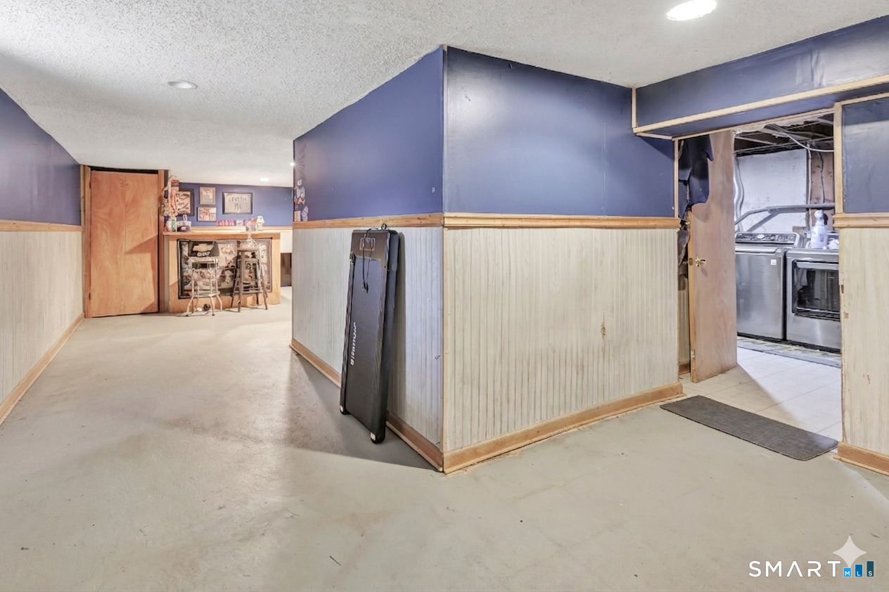 9 Alan Drive Ansonia, CT 06401 - Photo 30 of 34 a view of a refrigerator and storage in a room