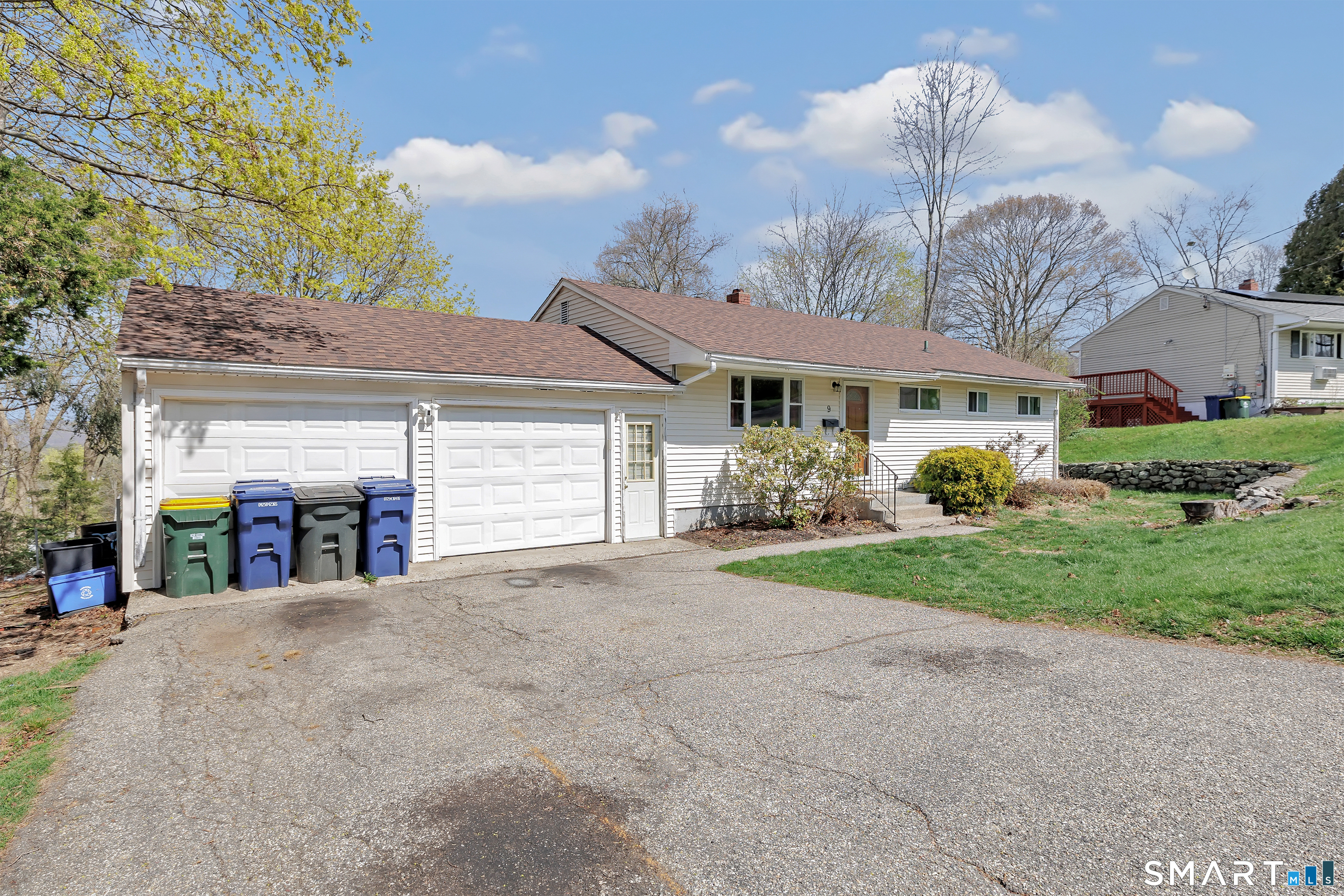 9 Alan Drive Ansonia, CT 06401 - Photo 3 of 34 a view of a house with a yard and potted plants