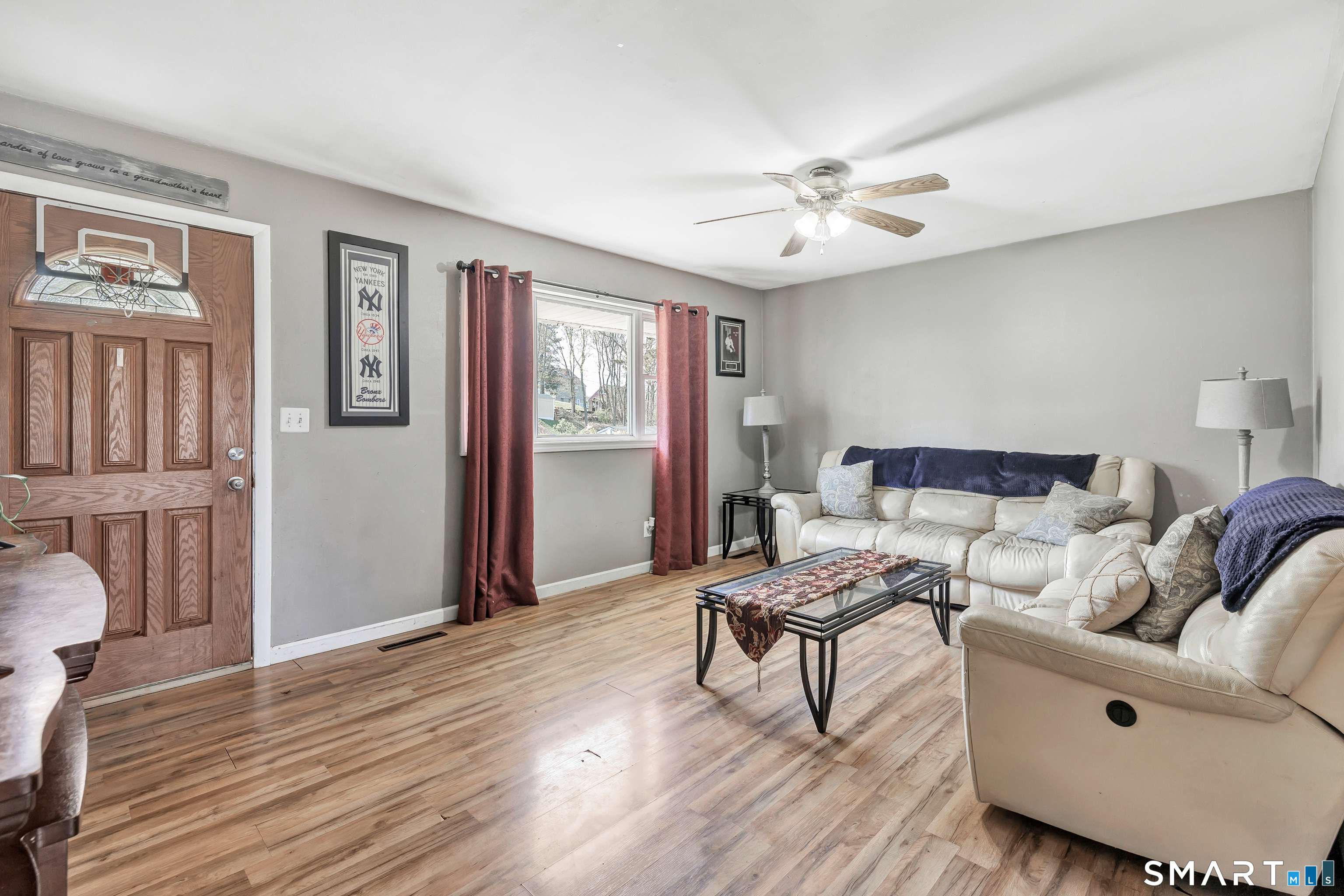9 Alan Drive Ansonia, CT 06401 - Photo 5 of 34 a living room with furniture and wooden floor