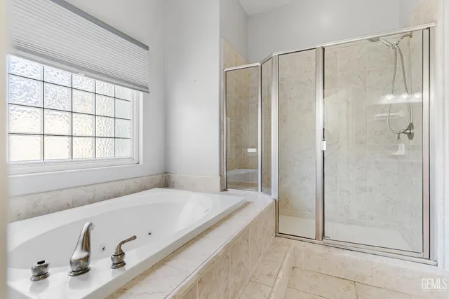 a bathroom with a tub and a sink