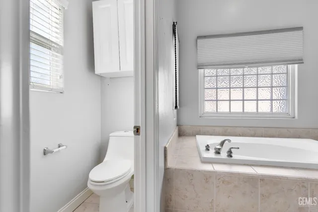 a bathroom with a sink a toilet and a bathtub