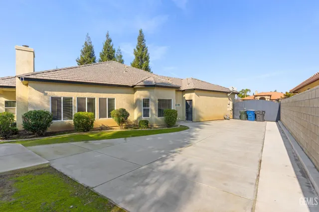 a front view of a house with a yard and porch