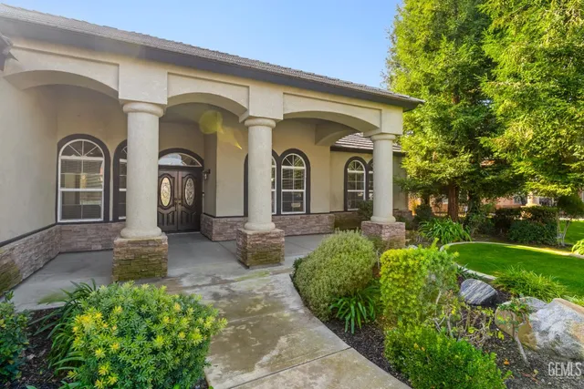 a front view of a house with garden