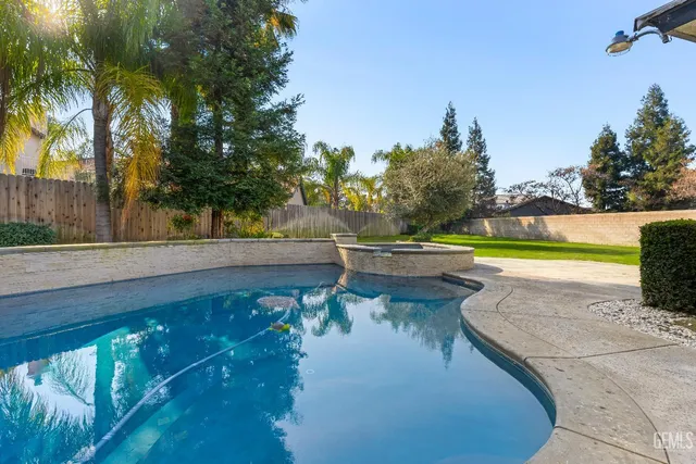 a view of swimming pool with a yard