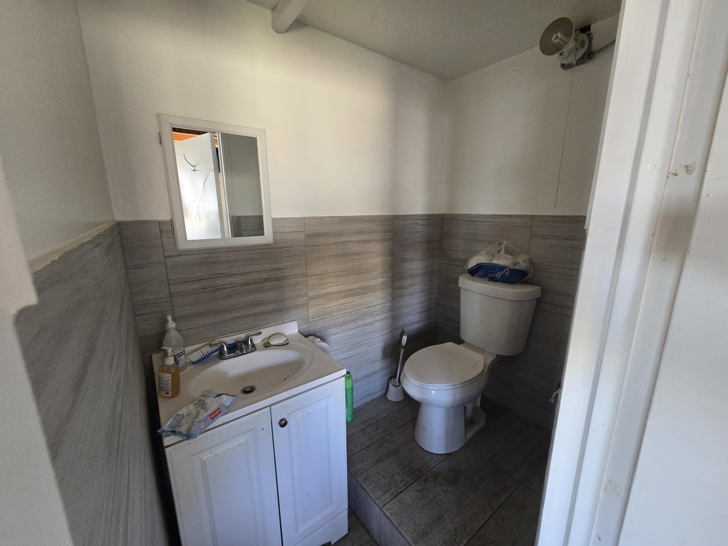 4800 Hansen Ranch Road Garberville, CA 95542 - Photo 4 of 23 a bathroom with a toilet and a sink