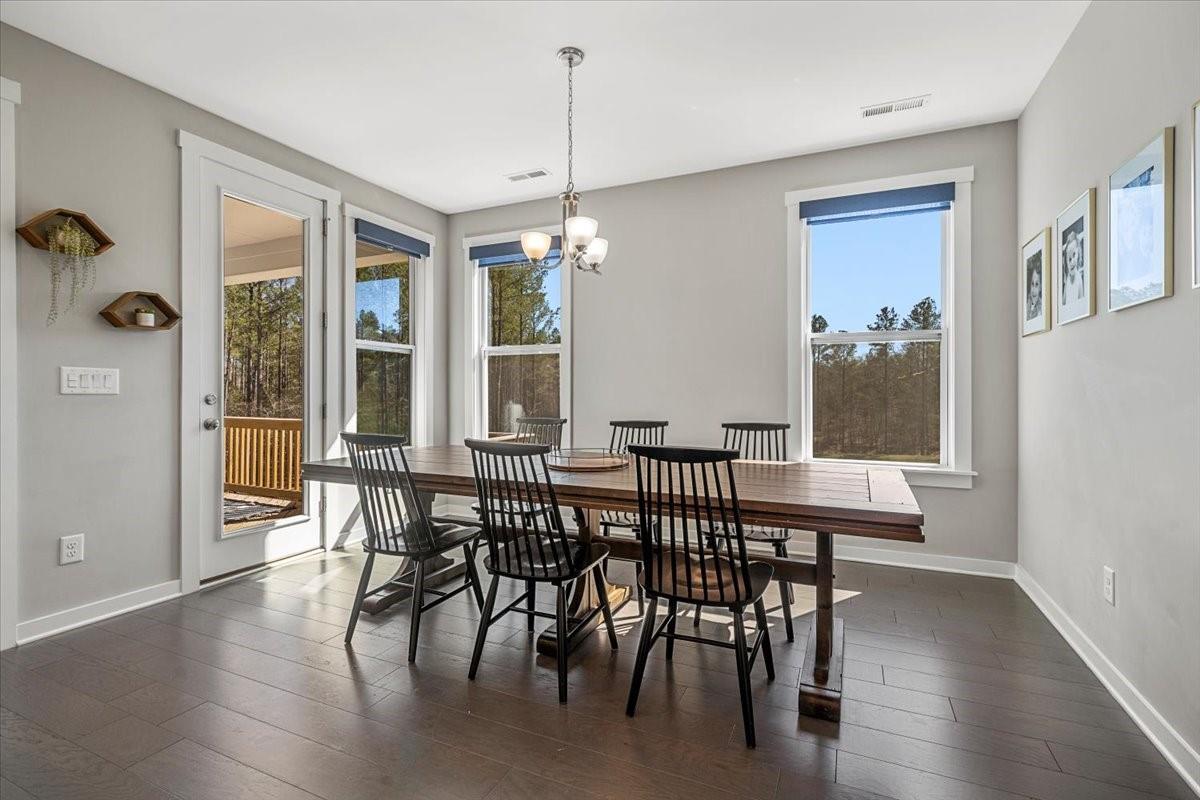 3728 Rustic Pne Way Clover, SC 29710 - Photo 20 of 48 a view of a dining room with furniture window and wooden floor