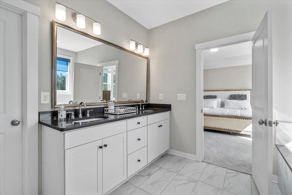 3728 Rustic Pne Way Clover, SC 29710 - Photo 39 of 48 a bathroom with double sink and a mirror