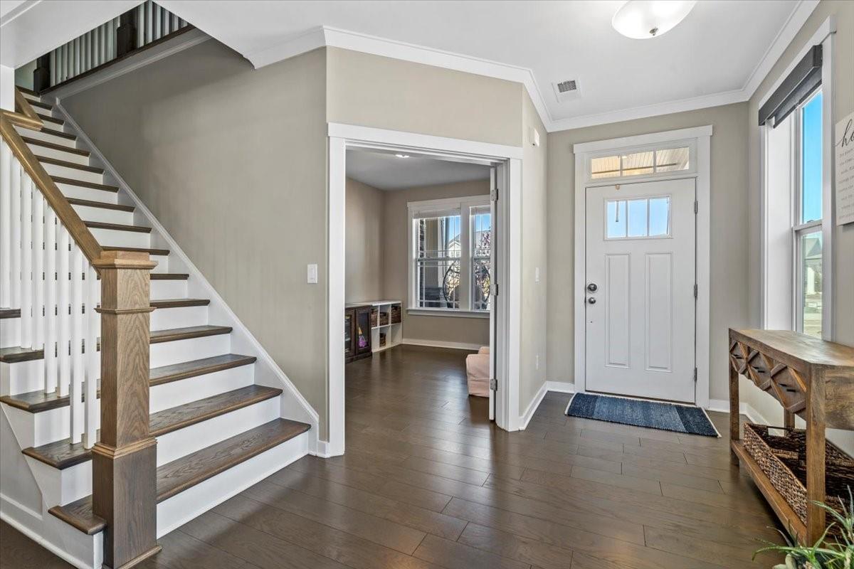 3728 Rustic Pne Way Clover, SC 29710 - Photo 4 of 48 a view of an entryway with wooden floor and stairs