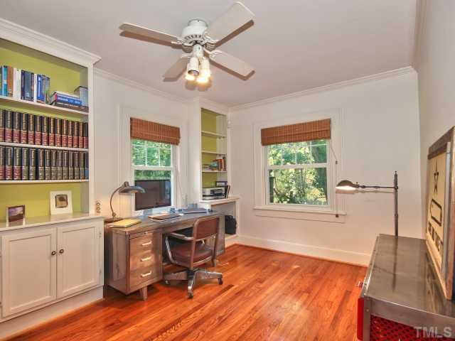 2710 Kilgore Avenue Raleigh, NC 27607 - Photo 12 of 24 Another main floor bedroom has been converted to an office with the addition of multiple built in units. Large closet under stairs has great storage
