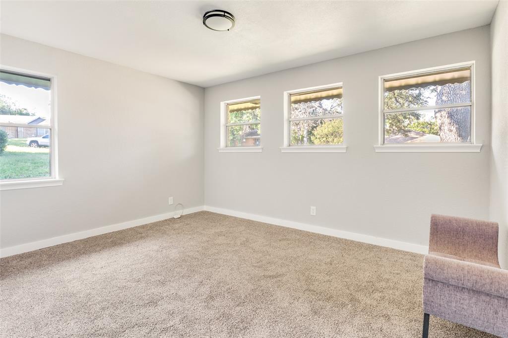 1287 Whispering Trail Dallas, TX 75241 - Photo 16 of 24 an empty room with windows