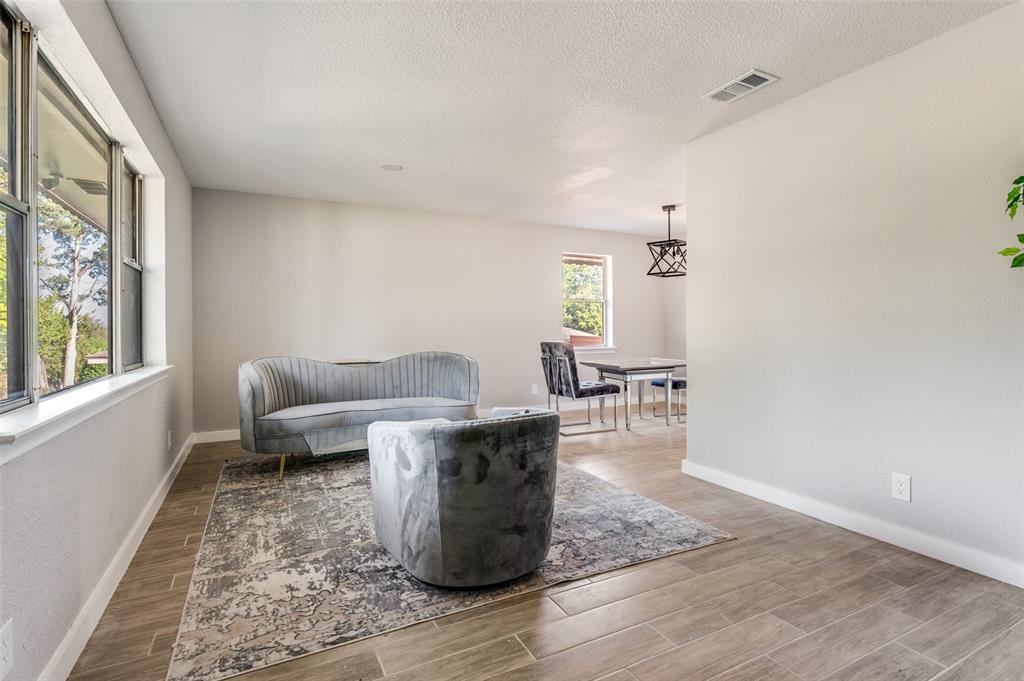 1287 Whispering Trail Dallas, TX 75241 - Photo 6 of 24 a living room with furniture and a window