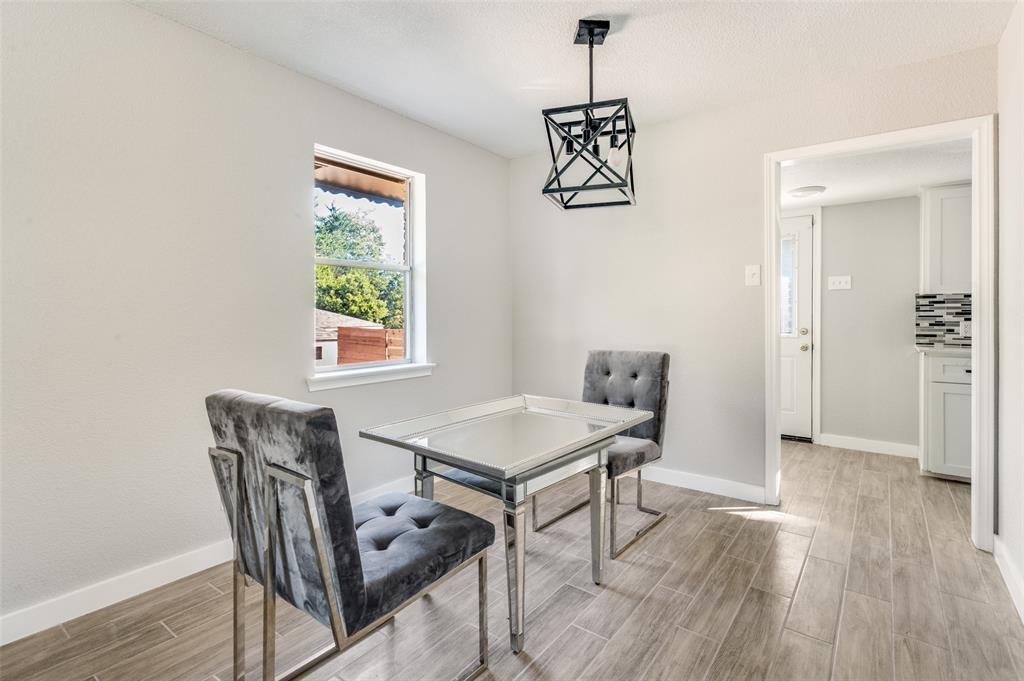1287 Whispering Trail Dallas, TX 75241 - Photo 9 of 24 a view of a dining room with furniture window and wooden floor