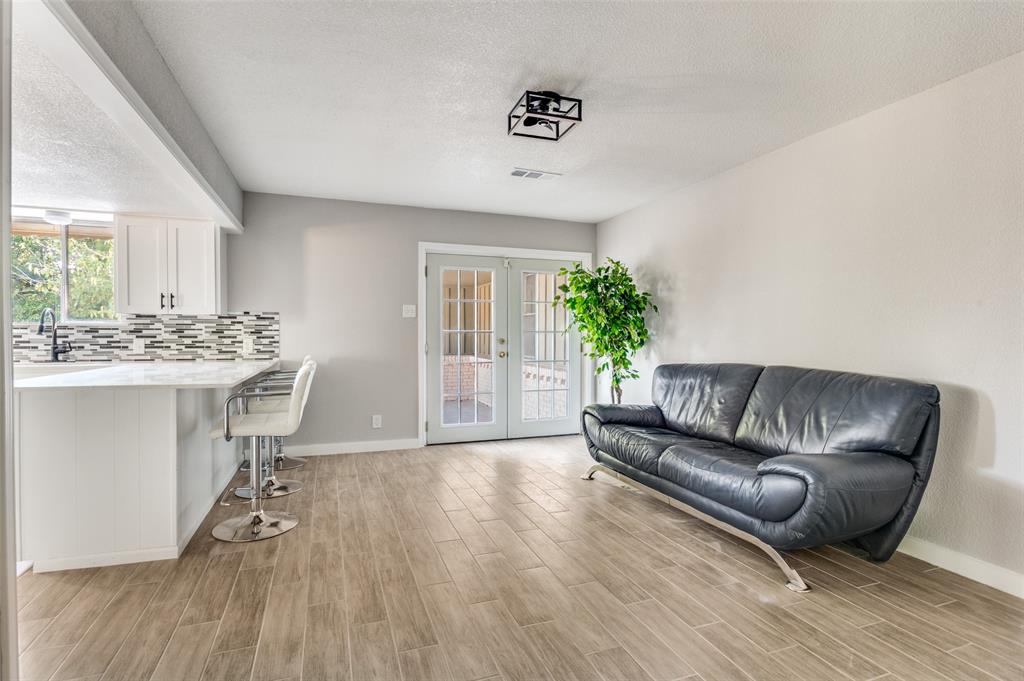1287 Whispering Trail Dallas, TX 75241 - Photo 10 of 24 a living room with furniture and a wooden floor
