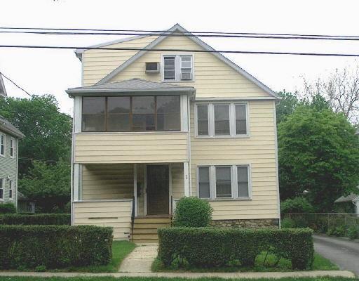 59 Colonial Road Stamford, CT 06906 - Photo 1 of 1 a front view of a house with a yard