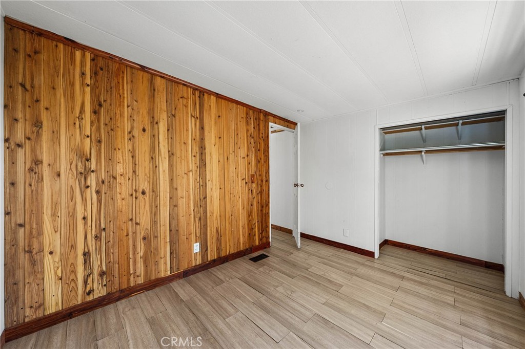 3360 Yuba Street Nice, CA 95464 - Photo 22 of 50 a view of an empty room with wooden floor
