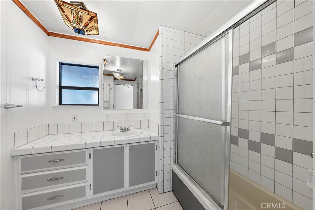 3360 Yuba Street Nice, CA 95464 - Photo 23 of 50 a bathroom with a double vanity sink and mirror