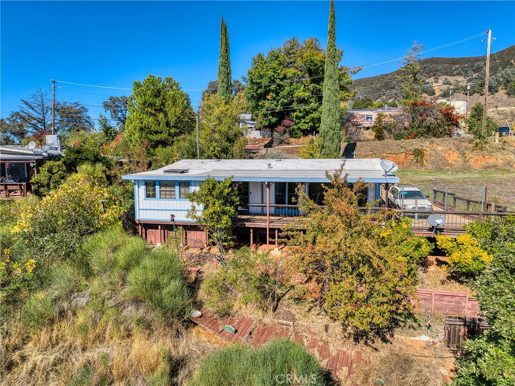 3360 Yuba Street Nice, CA 95464 - Photo 31 of 50 a view of a house with a yard and sitting area
