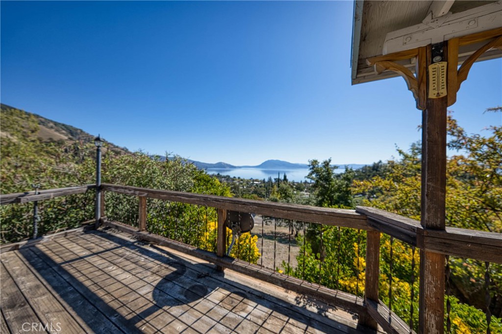 3360 Yuba Street Nice, CA 95464 - Photo 35 of 50 a view of a balcony with wooden floor and outdoor seating