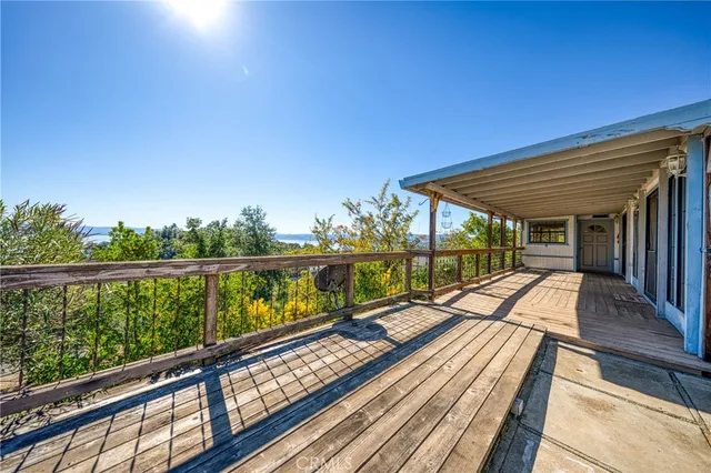 a view of balcony with wooden floor