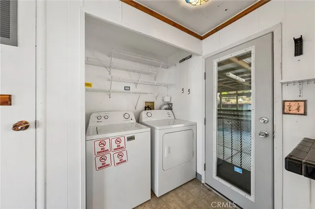a view of a room with a window and wooden floor
