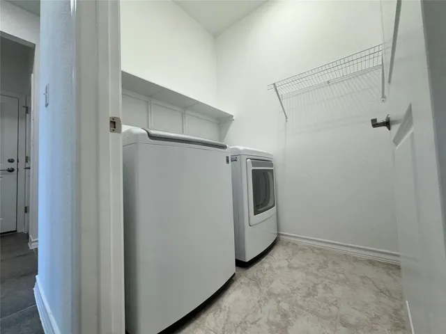 a view of a storage & utility room with closet