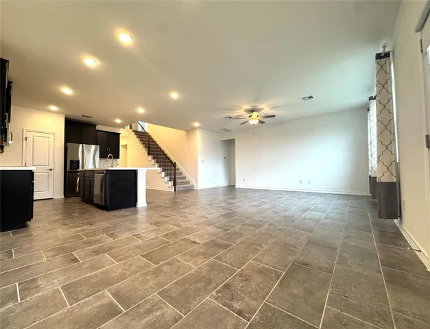 a view of a livingroom with a kitchen