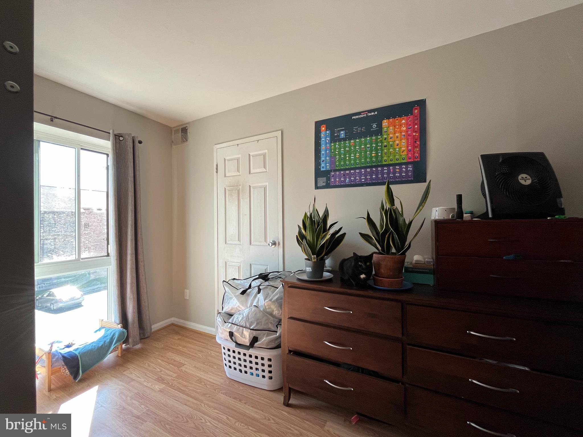 6153 Edsall Road, Unit E Alexandria, VA 22304 - Photo 11 of 12 a living room with furniture and a flat screen tv