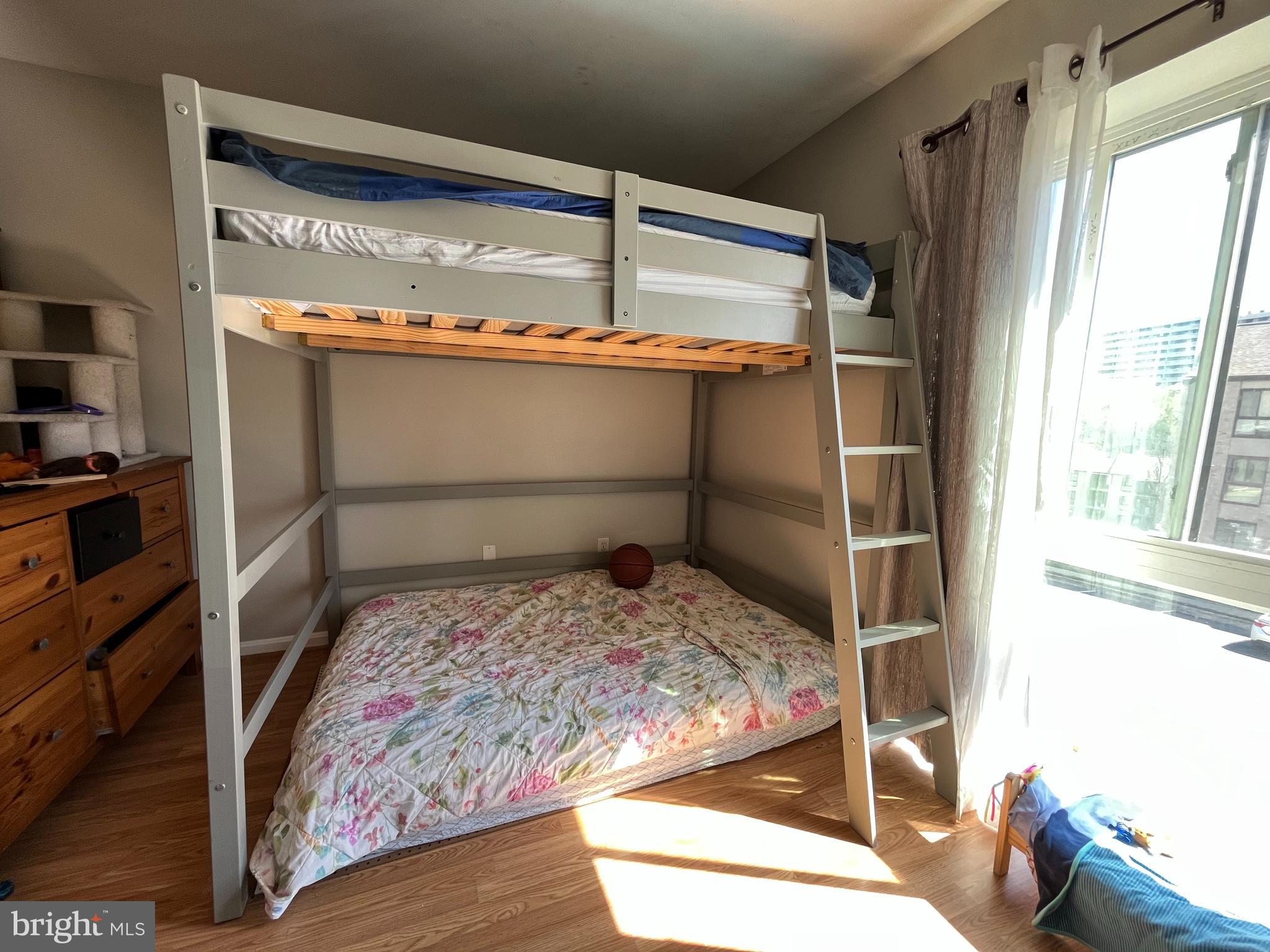 6153 Edsall Road, Unit E Alexandria, VA 22304 - Photo 12 of 12 a bedroom with a bed and a window