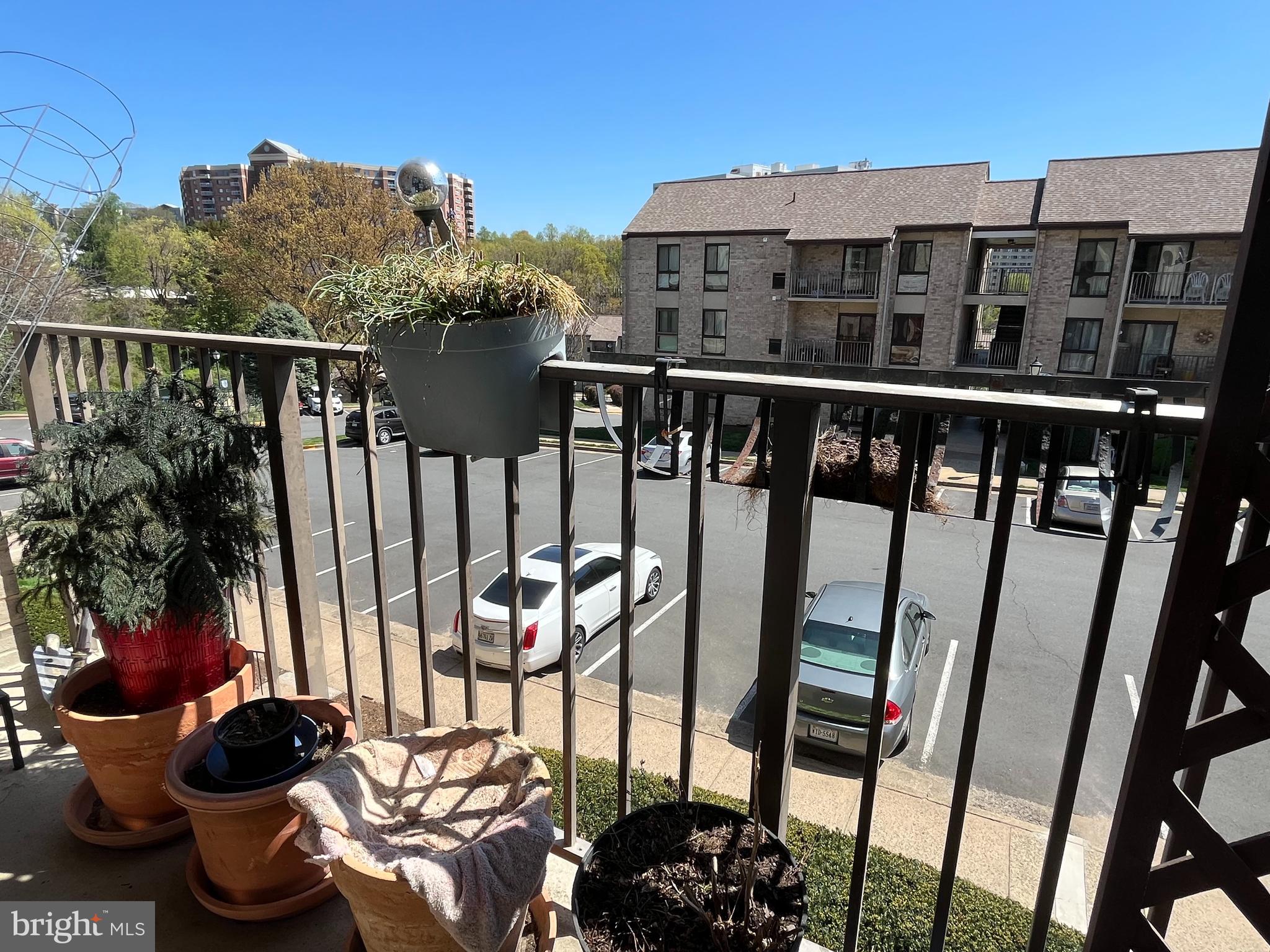 6153 Edsall Road, Unit E Alexandria, VA 22304 - Photo 7 of 12 a view of a balcony with chairs and potted plants