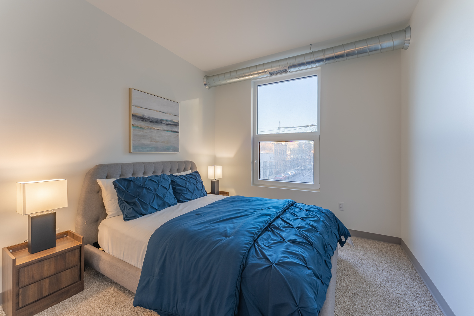 Undisclosed Address Chicago, IL 60642 - Photo 12 of 15 a bedroom with a bed and window