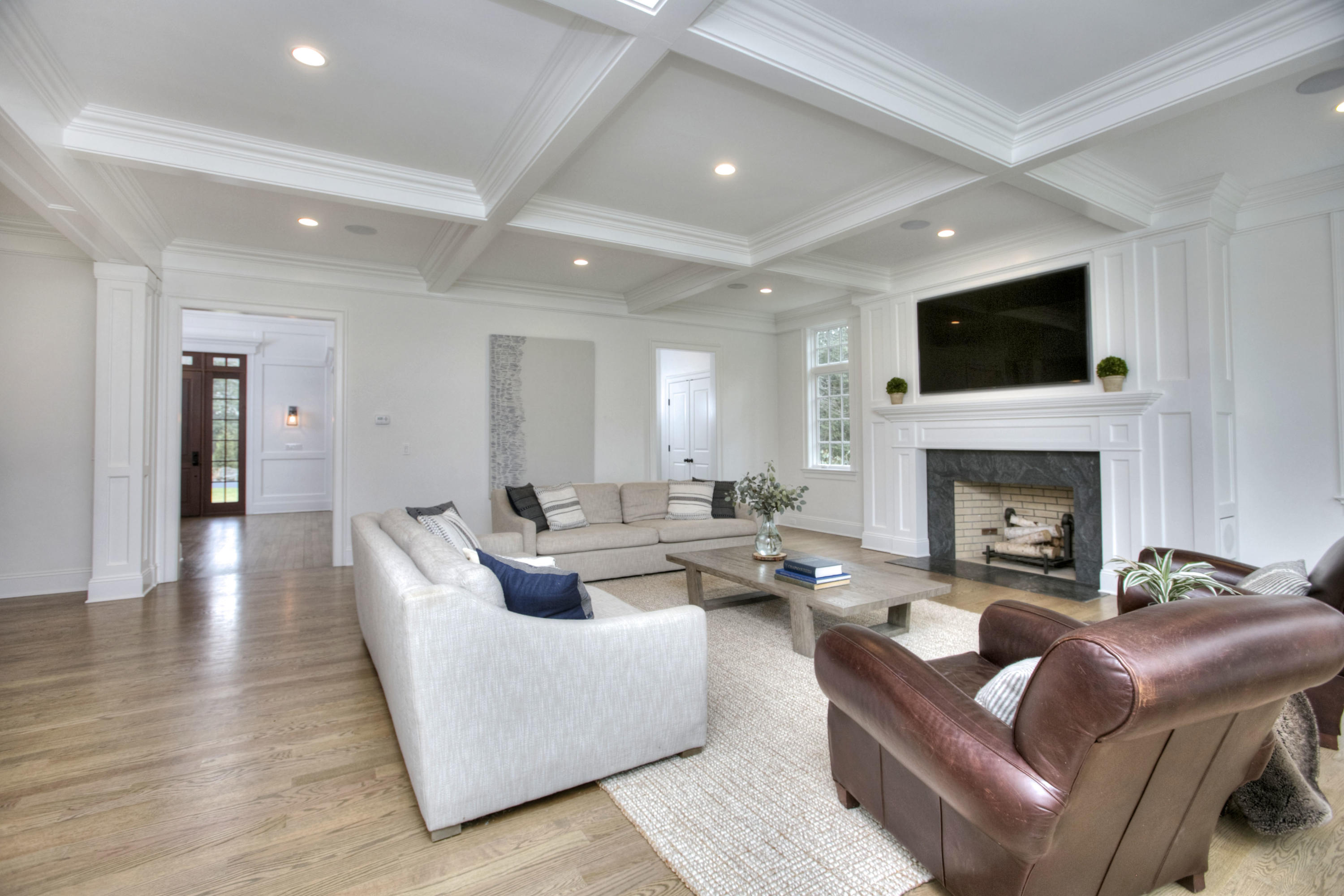 61 Stony Brook Road Darien, CT 06820 - Photo 14 of 43 a living room with furniture a flat screen tv and a fireplace